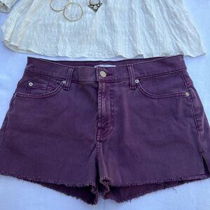 Beautiful purple color in vintage wash lightly frayed shorts.